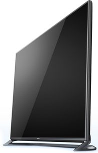 Panasonic TX-65CX800 black flat screen TV, shown in profile, mounted on a silver metallic stand