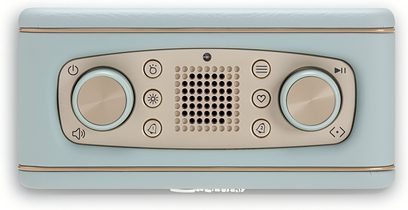 Radio til bordet Roberts Revival Rest, rektangulært kabinet i himmelblå kunstlæder med beige kontrolpanel, der integrerer en central højttalergitter og to store cirkulære drejeknapper, set ovenfra