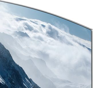 Samsung UE65KS9000 buet TV-skærm, der viser skyer og sneklædte bjerge, set fra siden
