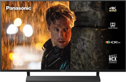 Panasonic TX-40GX800E 4K HDR-fladskærm, der viser et nærbillede af en korthaaret mands ansigt i regnen