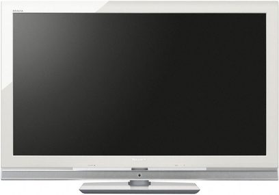 Sony KDL-40WE5W TV, slukket skærm, smal hvid ramme, grå metalliseret base, på hvid overflade