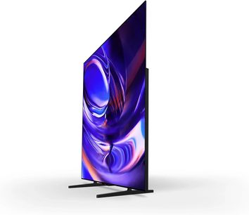 Televisore Sony BRAVIA 6 K65A60 visto di tre quarti, schermo sottile che mostra un motivo astratto viola e blu su supporto nero