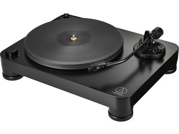 Black Audio Technica AT-LP7X vinyl turntable in three-quarter view, with a large platter and straight tonearm on the right