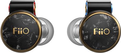 Pair of black FiiO FD3 Pro in-ear headphones seen from the front, circular black marbled faceplates edged with gold metal and featuring a gold logo, glossy black rear housing marked with red and blue rings, and translucent silicone tips
