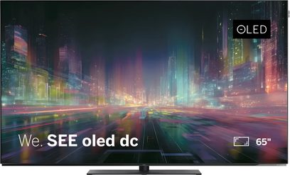 Loewe We. SEE oled dc 65-inch television, black flat screen with colorful urban visual seen from the front