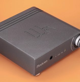 Black Madison audio amplifier with large volume knob, headphone jack and front panel indicator lights