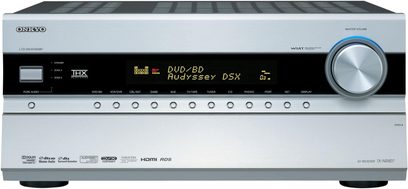 Onkyo TX-NR807 sølvfarvet hjemmebiografsforstærker, set forfra, displayet viser "DVD BD Audyssey DSX", mange knapper og stik