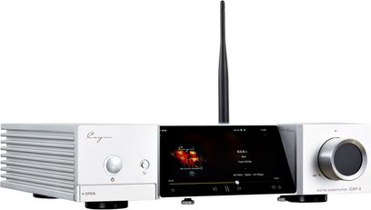 Cayin iDAP-8 silver aluminum network audio player, front three-quarter view, with cooling fins on the left, central black touchscreen, large rotary knob on the right, and vertical black antenna