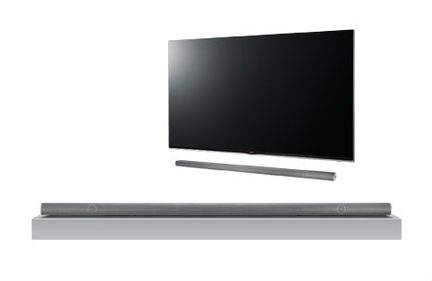 Sort OLED-tv set forfra, med grå soundbar nedenunder, på hvid baggrund