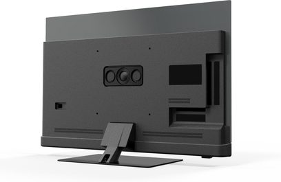 Panasonic TV-48Z90BE6 højopløsnings-tv i mat sort plast med fladt metalstativ, centralt bagmodul med tre cirkulære højttalere og ventilationsåbninger, set bagfra i trekvart profil