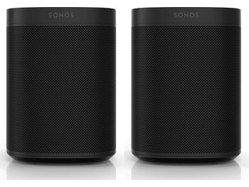 To cylindriske Sonos One (Gen 2) højttalere i mat sort, med sort gitter over hele højden, "SONOS"-logo øverst, set forfra