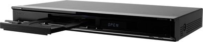 Sony BDP-S357 sort 4K Blu-ray-afspiller, set forfra, med åben bakke, knapper og porte på forsiden