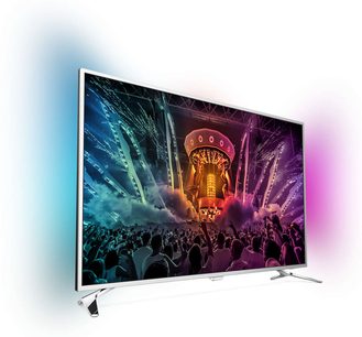 Fladskærms-TV fra Philips 43PUS6501/12 viser en folkemængde ved en koncert med pyroteknikeffekter