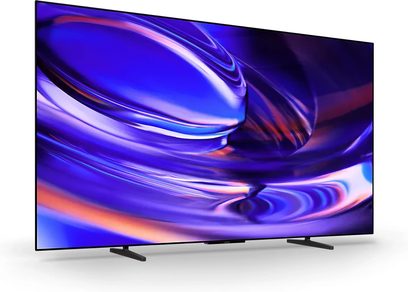 Televisore Sony BRAVIA 6 K65A60 nero a schermo piatto su due piedini, vista di tre quarti con immagine astratta blu e viola