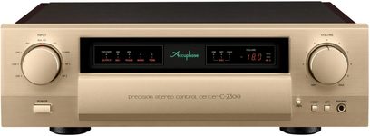 Preamplificador estéreo C-2300, vista frontal, carcasa rectangular dorada, dos grandes botones circulares, pantalla central