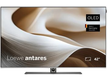 Lameda ekraaniga 42-tolline OLED-teler Loewe Antares, hõbedase raami ning musta ja halli keskjalaga