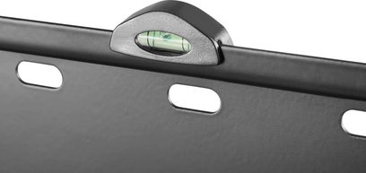 Integrated bubble level in the rounded matte black top portion of a metal TV wall mount, close-up