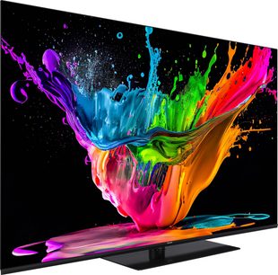 Téléviseur Panasonic TX-65MZ800E affichant une explosion de couleurs vives et fluides sur un fond noir