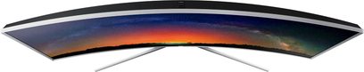 Samsung UE65JS9500 buet TV, slukket skærm der reflekterer en solnedgang i orange og mørkeblå farver