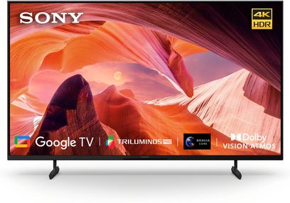 Sony KD43X80L fladskærms-tv set forfra, sort ramme, sorte fødder, orange canyon-display, logoer Google TV, TRILUMINOS PRO, BRAVIA CORE, Dolby Vision-Atmos, 4K HDR-ikon øverst til højre