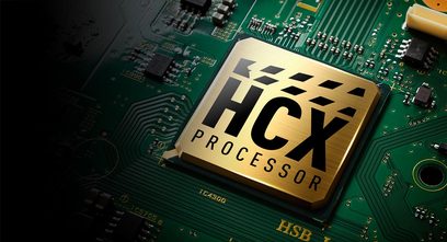 HCX-processor på grønt printplade med miniature elektroniske komponenter