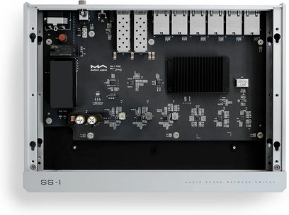 Matrix Audio SS‑1 in silver aluminum, top view with open case, black board with finned heatsink, two perforated SFP cages, and eight aligned RJ45 ports