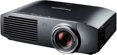 Panasonic PT-AT5000 black video projector, front view, centered lens, side ventilation grilles